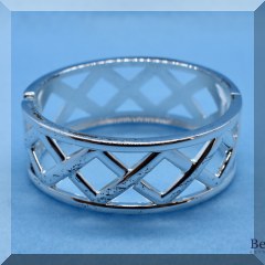 J31. Silvertone x hinged bangle bracelet - $6 